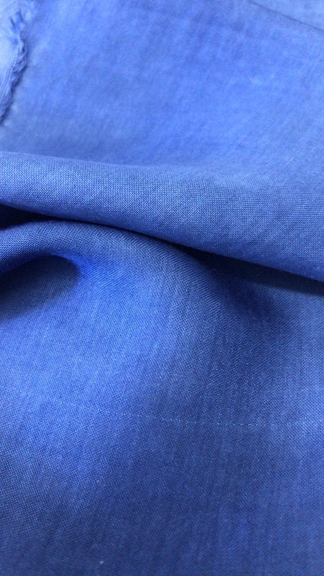 Close-up of blue fabric dyed Woad Powder (Isatis Tinctoria) with a textured pattern
