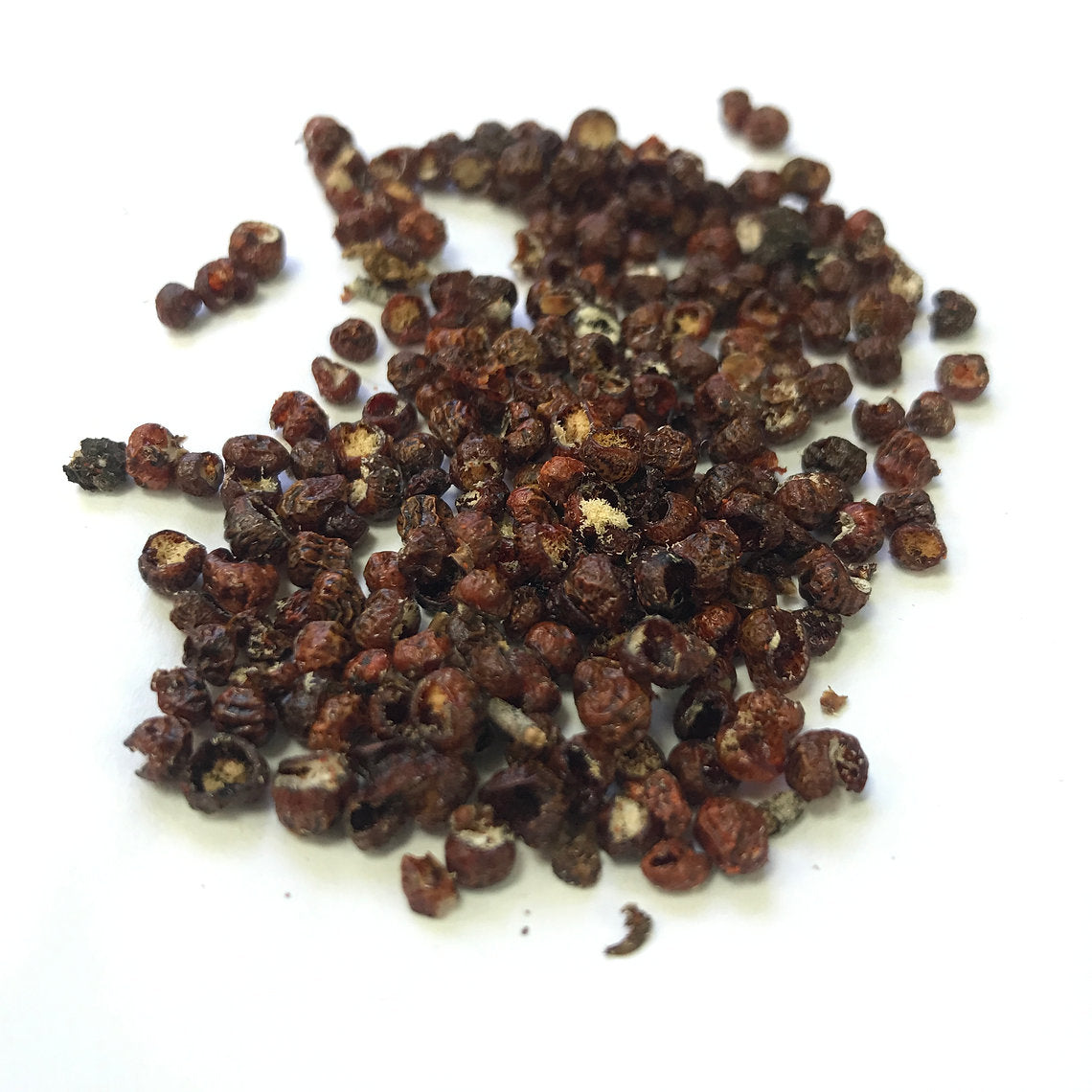 Pile of dark brown crimson on a white background